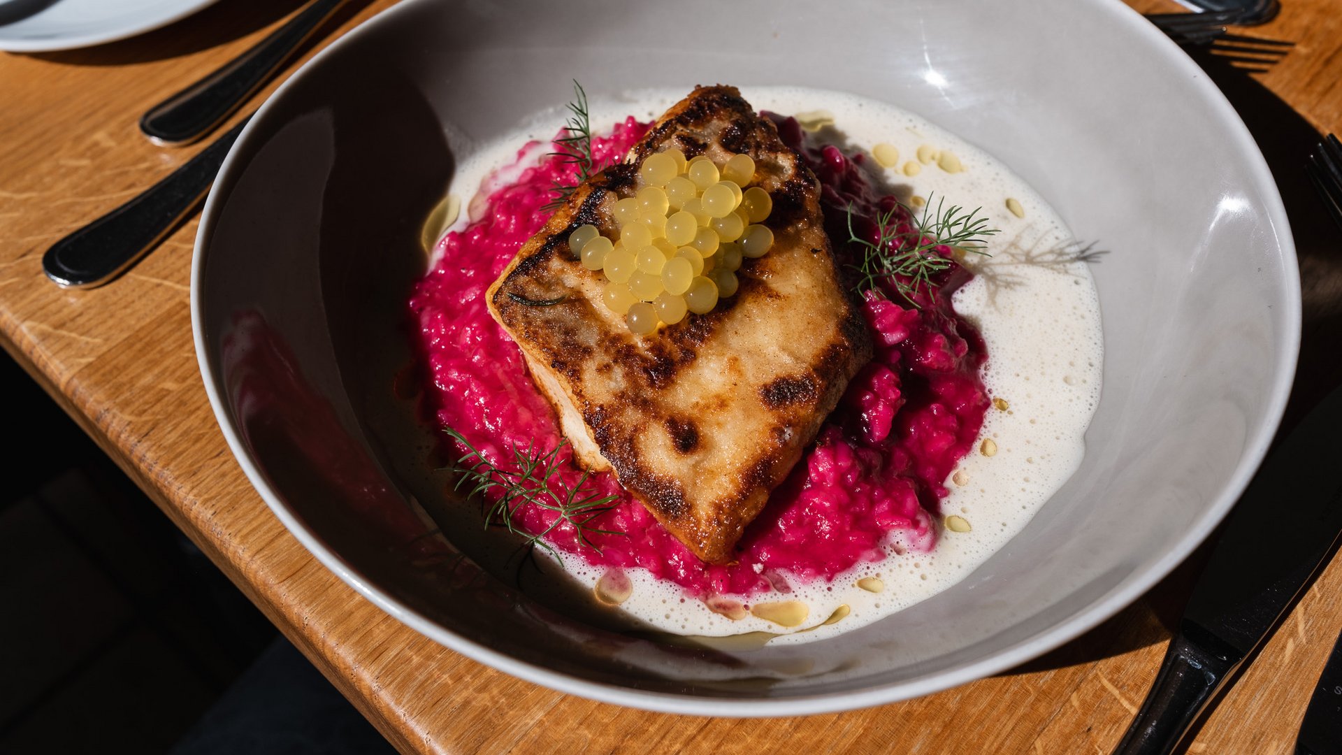 Inn & Restaurant in Parsberg serving regional cuisine Seared fillet on pink risotto with yellow pearls and herbs