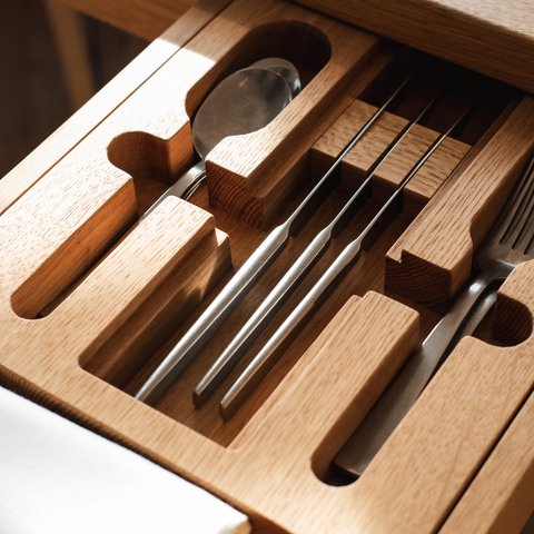 Restaurant in Parsberg: Enjoy gourmet Cutlery in a custom wooden compartment in an open drawer