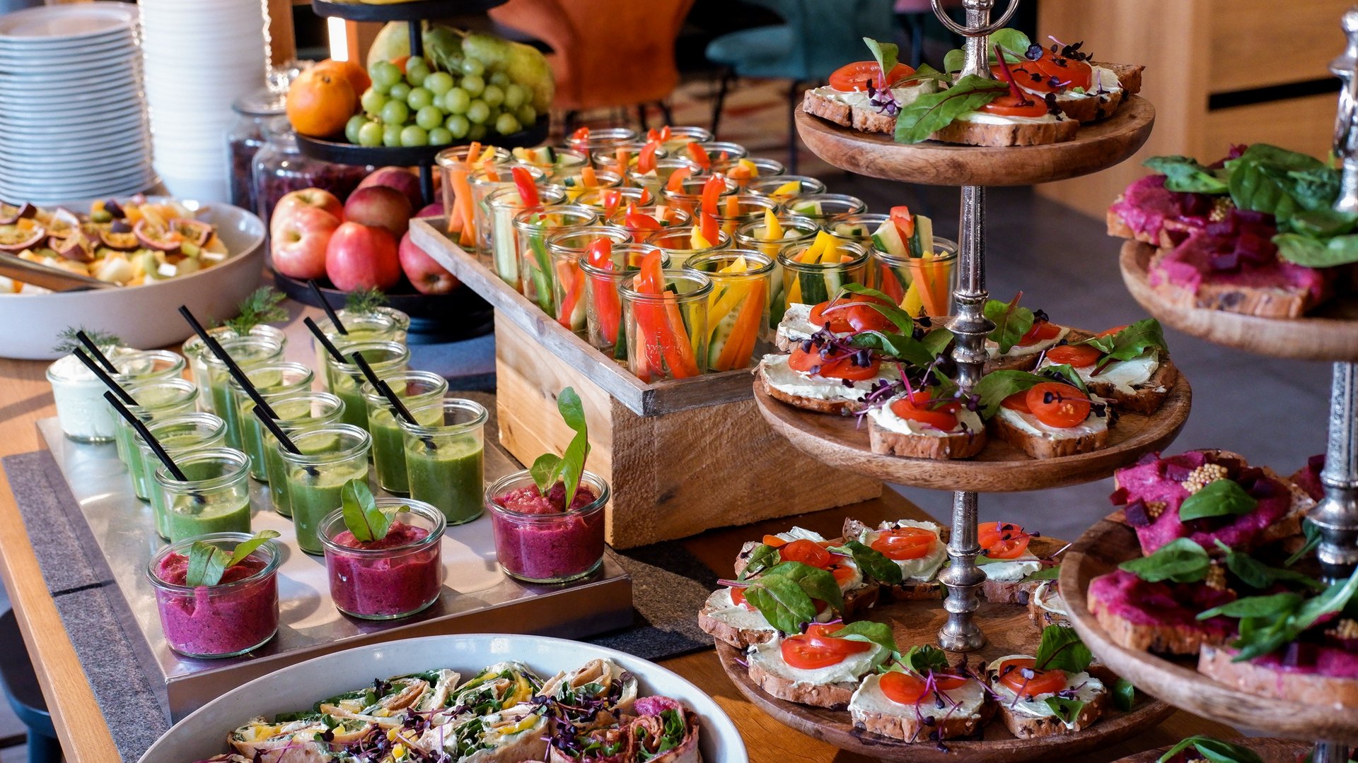 Services and rates for conferences and celebrations Varied buffet with vegetable sticks, dips, fruit, and topped bread