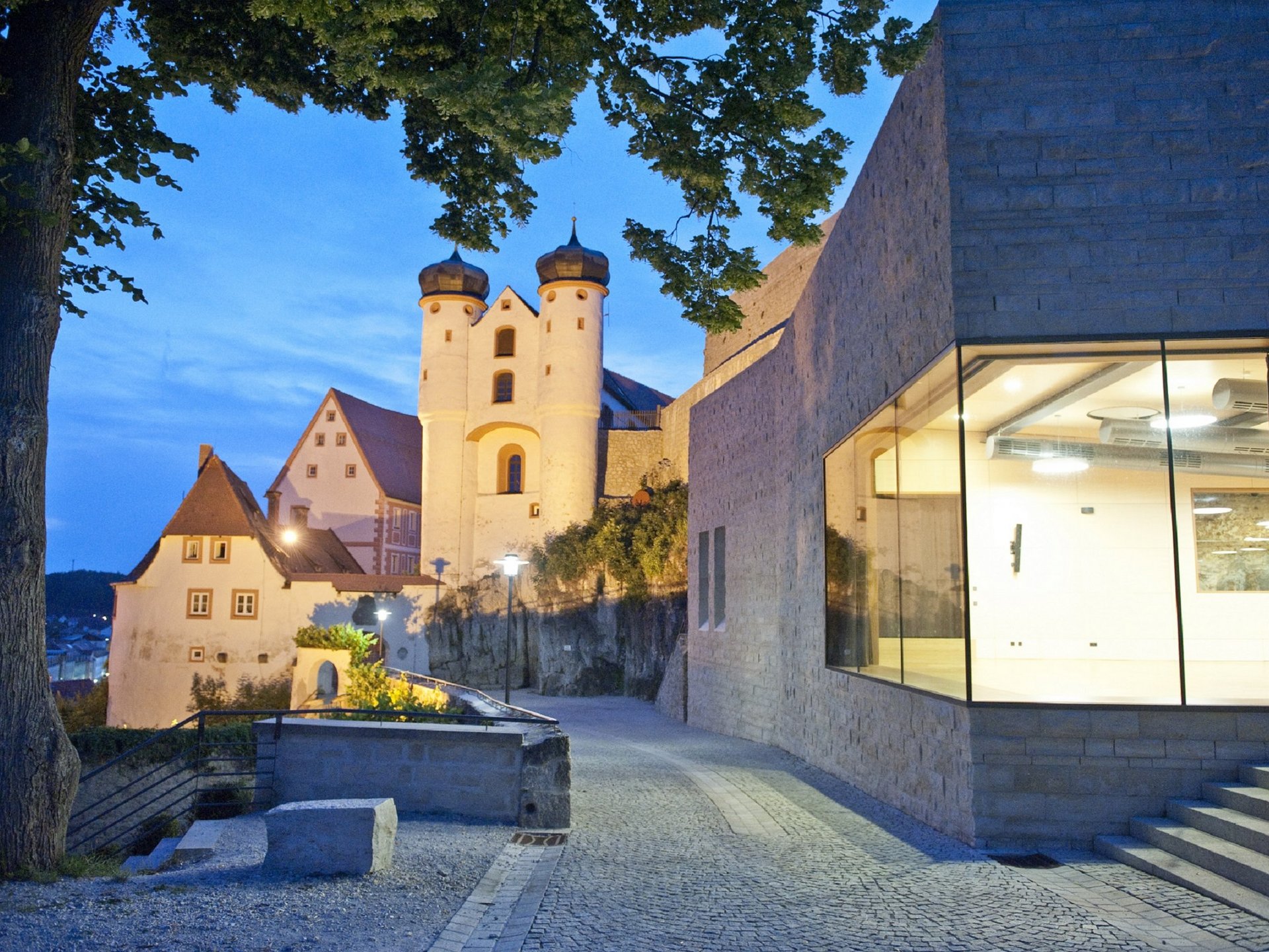Culture & Attractions Around Regensburg Historic castle complex at dusk with illuminated buildings