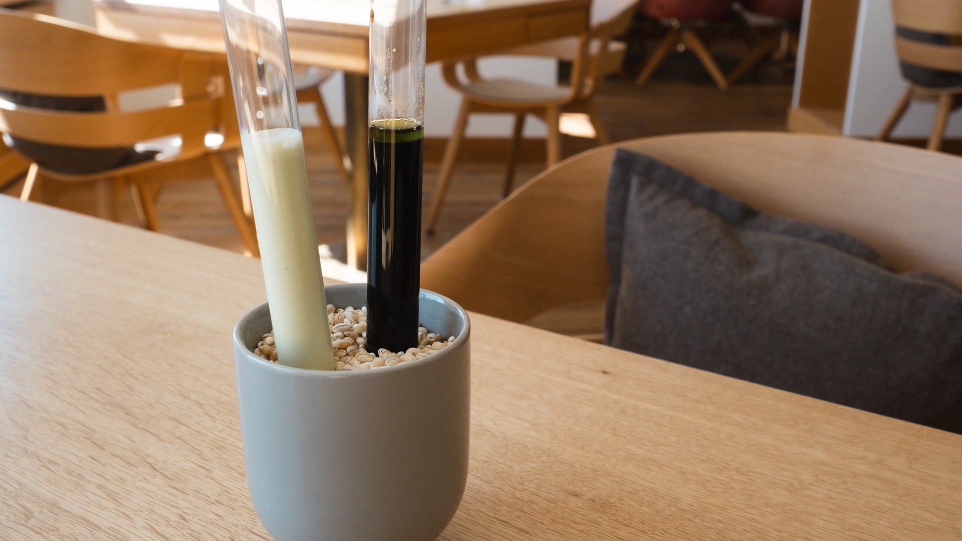 Fine Dining & Gourmet Cuisine in the Upper Palatinate Ceramic holder with grains and two tall glass tubes on a table